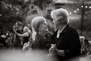 Two elderly clients in our Senior Services department dancing